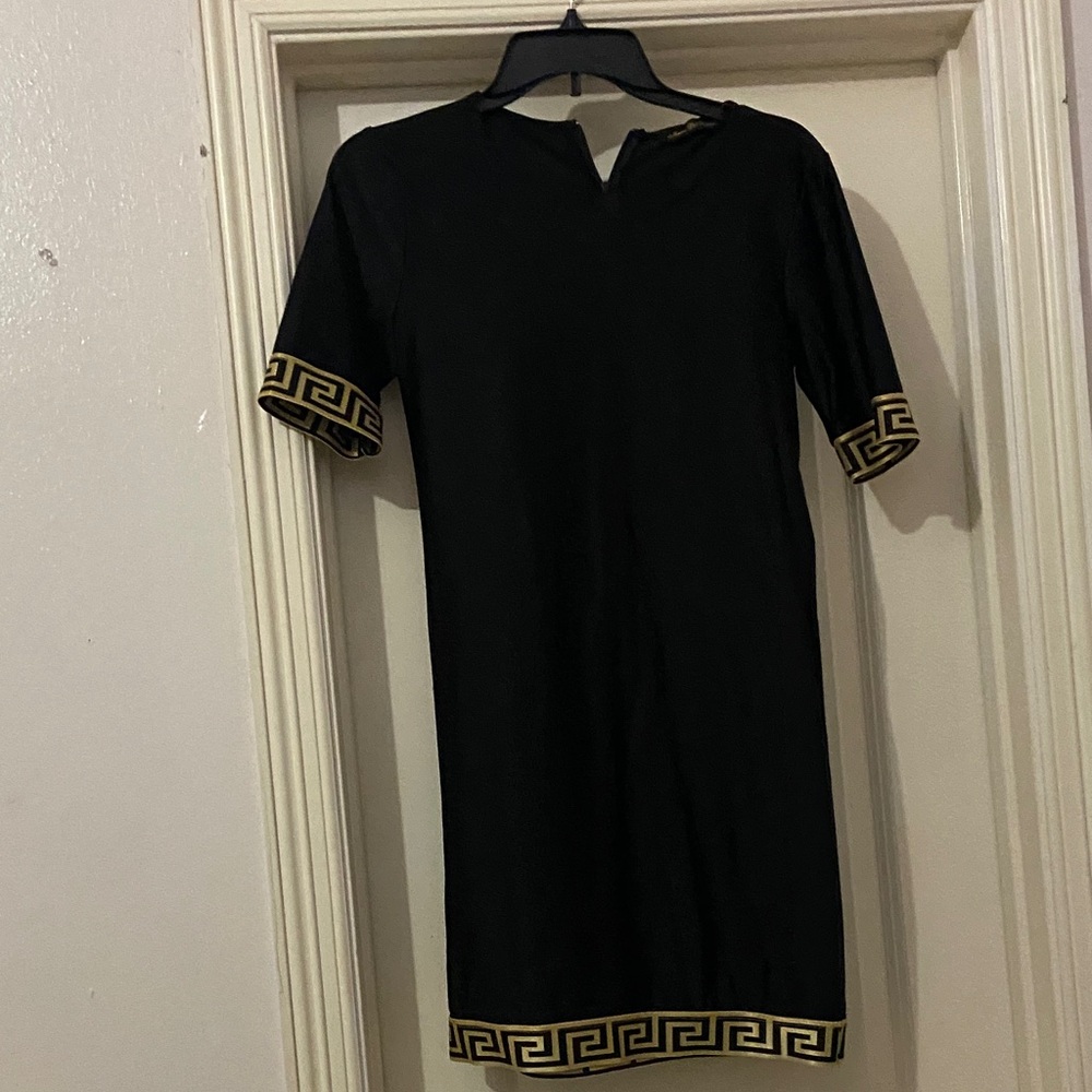 Chic Black Dress with Gold Trim